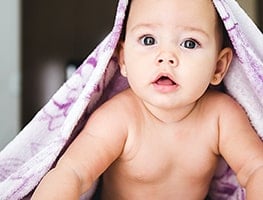 Baby with a towel on his head