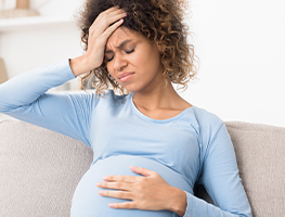 Pregnant woman experiencing discomfort