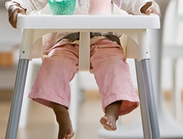 Baby sitting in a high-chair