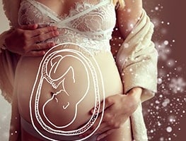 Illustrated baby drawn on a pregnant woman's belly