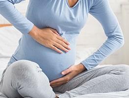 Woman experiencing signs of labour