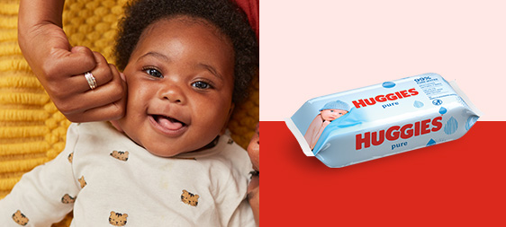 Smiling baby and Huggies Pure Wipes packet