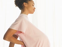 Week 38 pregnant woman experiencing back discomfort