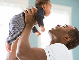 Dad holding his baby