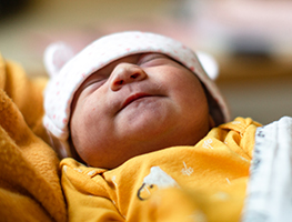 Newborn baby in mom's arms