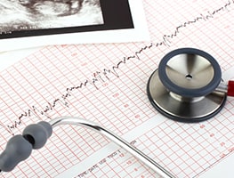 Stethoscope on an HCG level chart