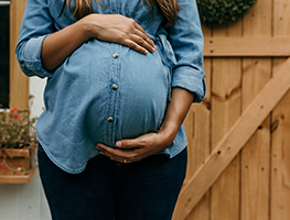 Woman holding her pregnant belly