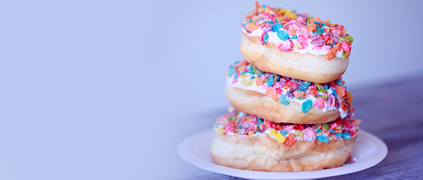 Stack of sugary doughnuts on a plate